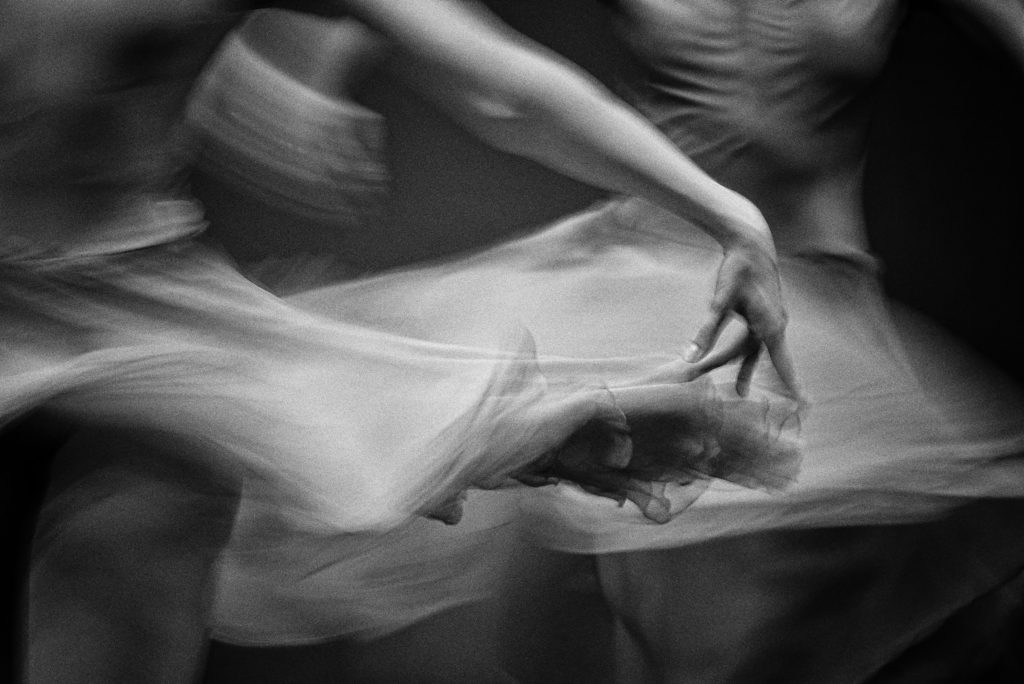 An experimental black and white photo of a dancer slightly blurred edges to illustrate boundaries, and energetic edges